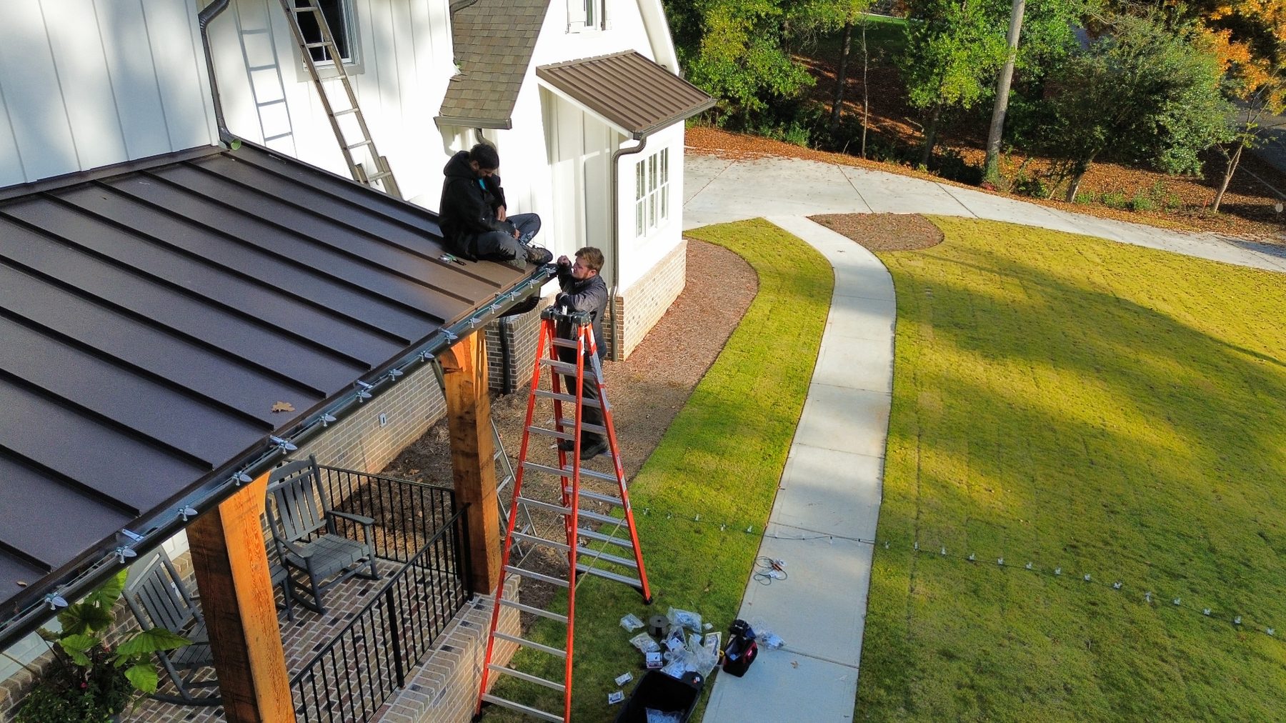 Aerial view of Dreamland Christmas light installation crew working on an Atlanta home